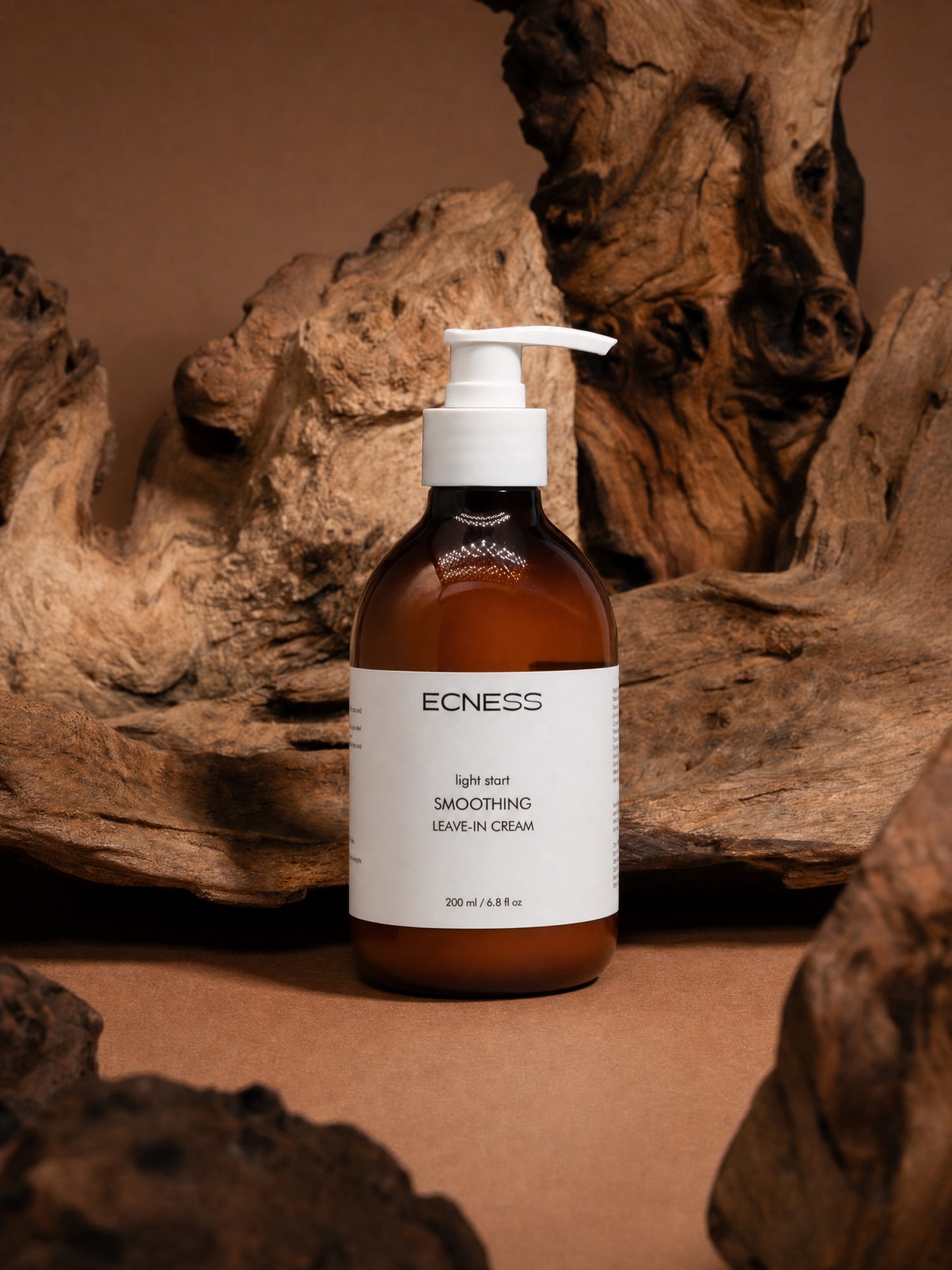 ECNESS Smoothing Leave-in Cream in a warm natural setting