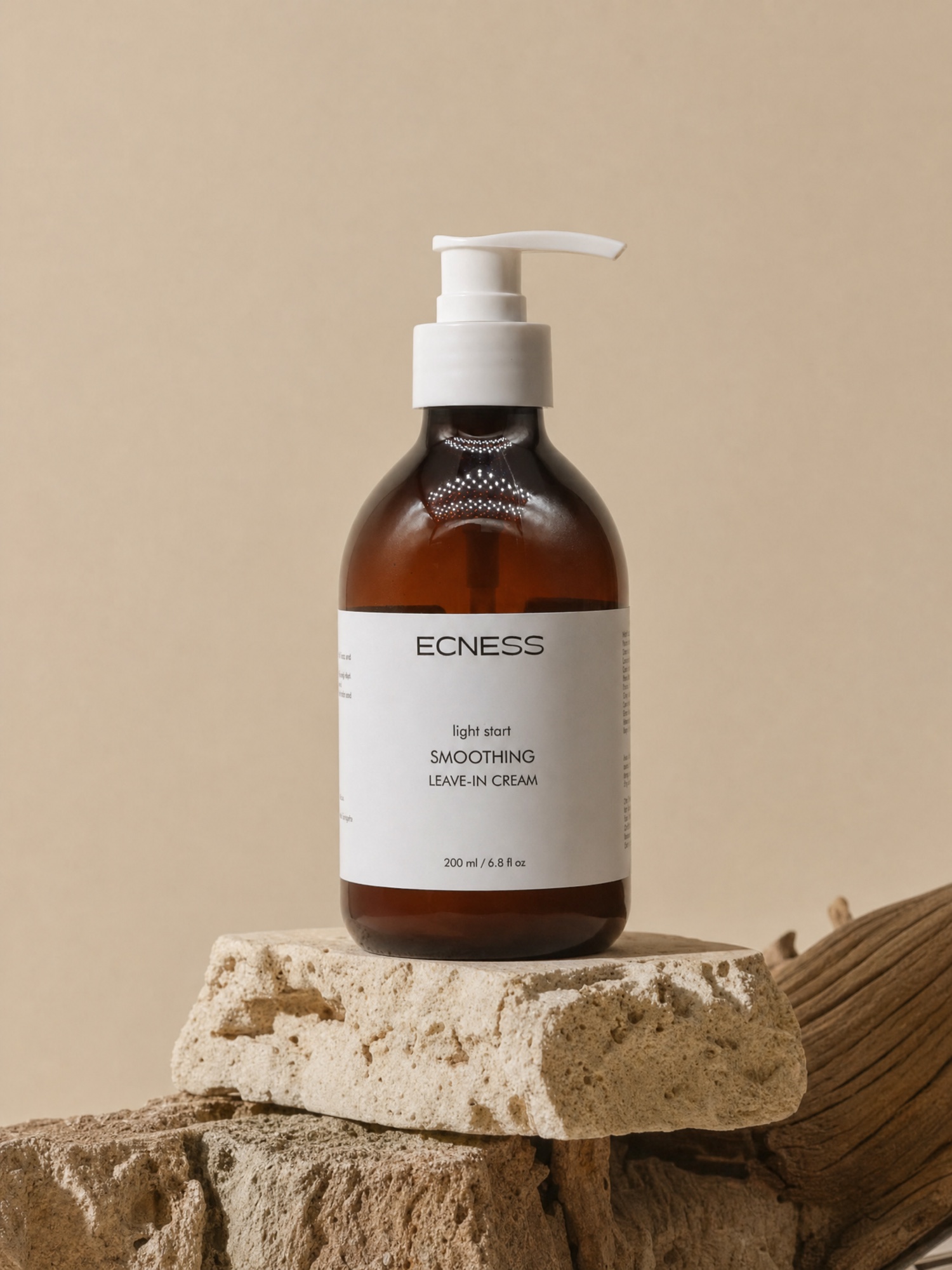 ECNESS Smoothing Leave-in Cream on a beige stone display