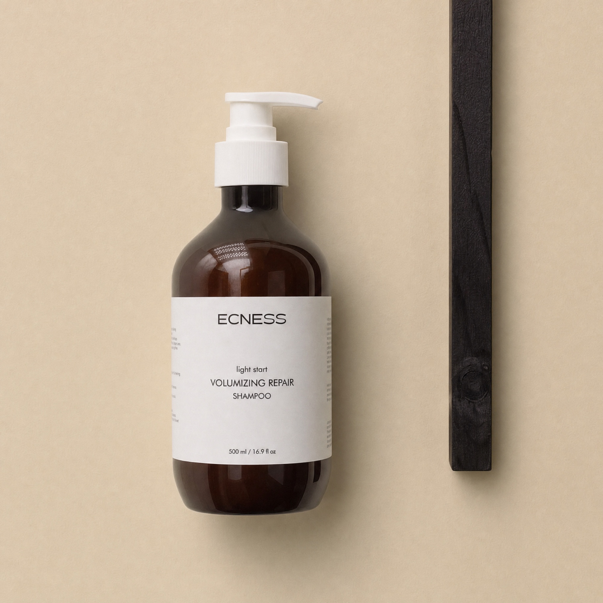 ECNESS Volumizing Repair Shampoo in a minimal flat-lay setting