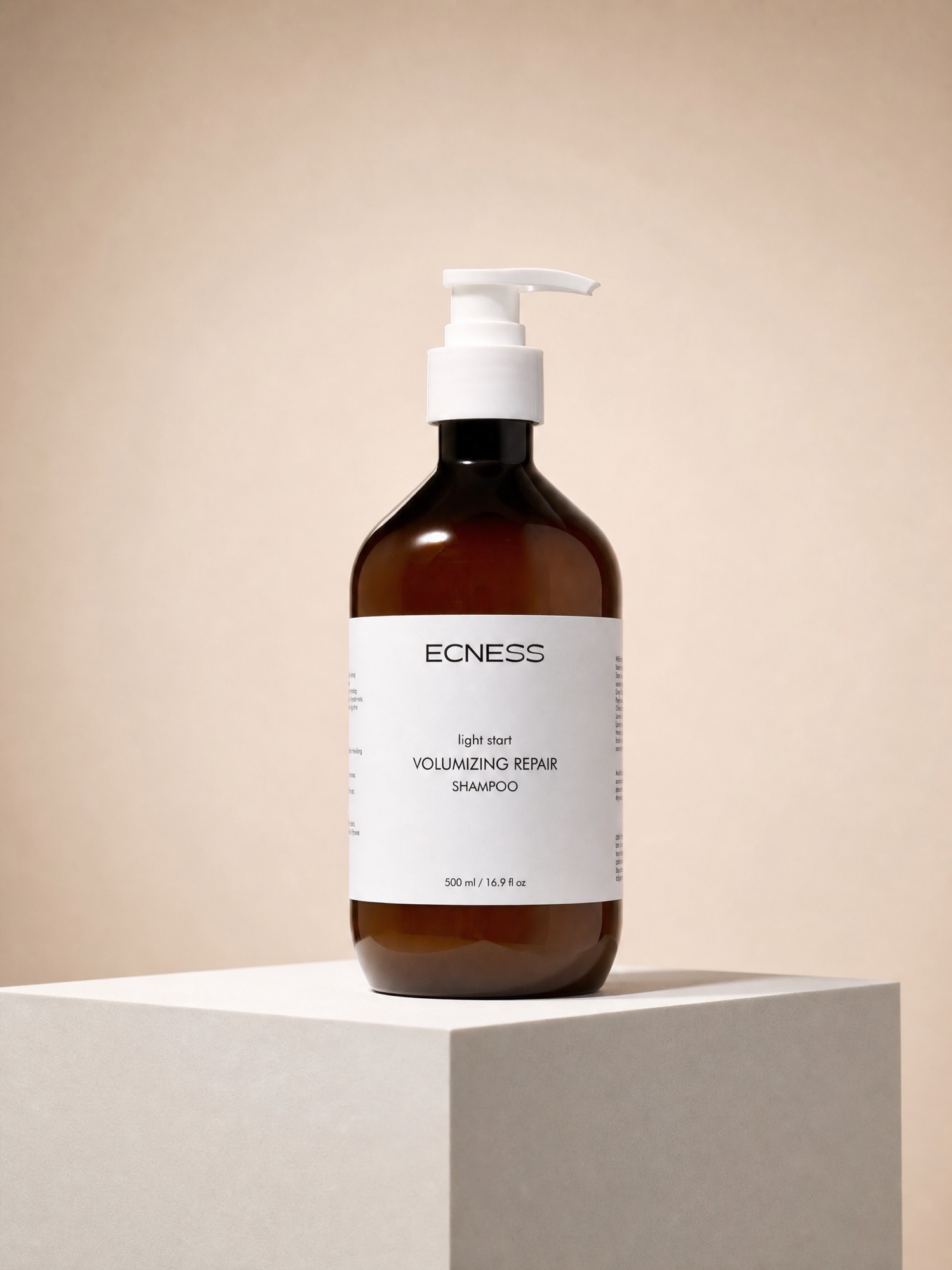 ECNESS Volumizing Repair Shampoo on a geometric display